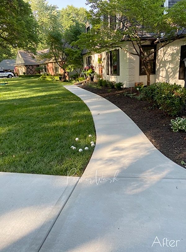 Surface clean concrete in PV, KS. Pressure wash driveway and front walkway.
